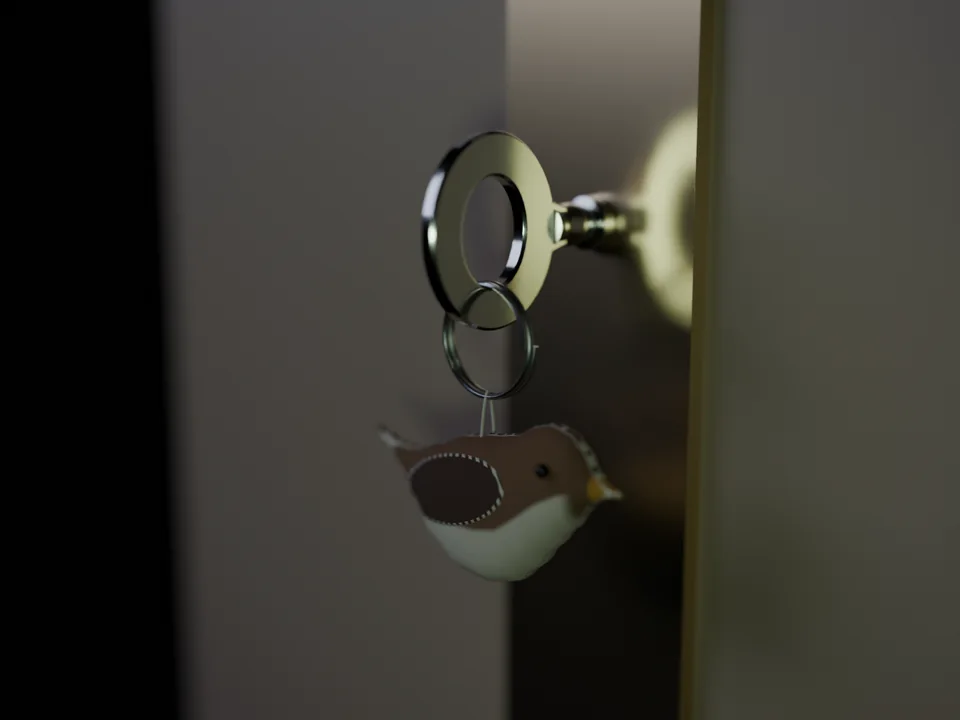 A key with a felt sparrow on its ring, in the lock of a dark door.