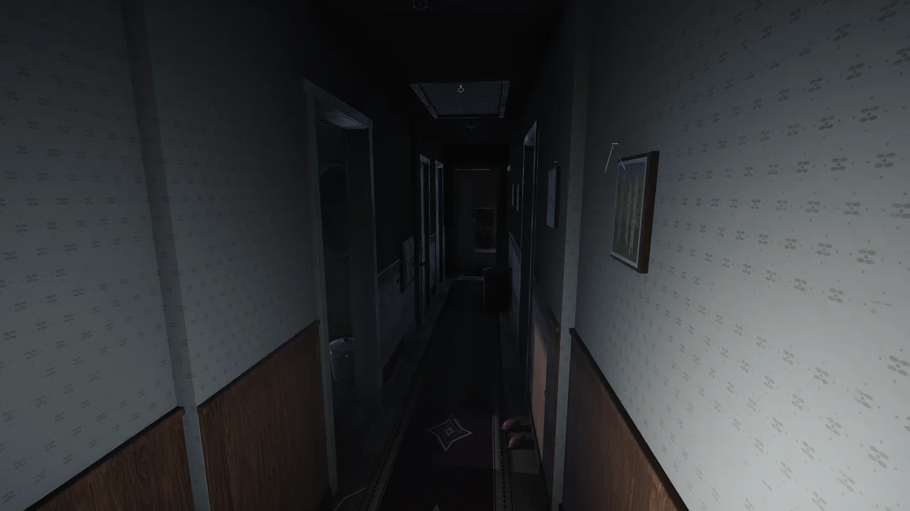 The upstairs corridor at night: patterned wallpaper, wood panelling and a long rug.